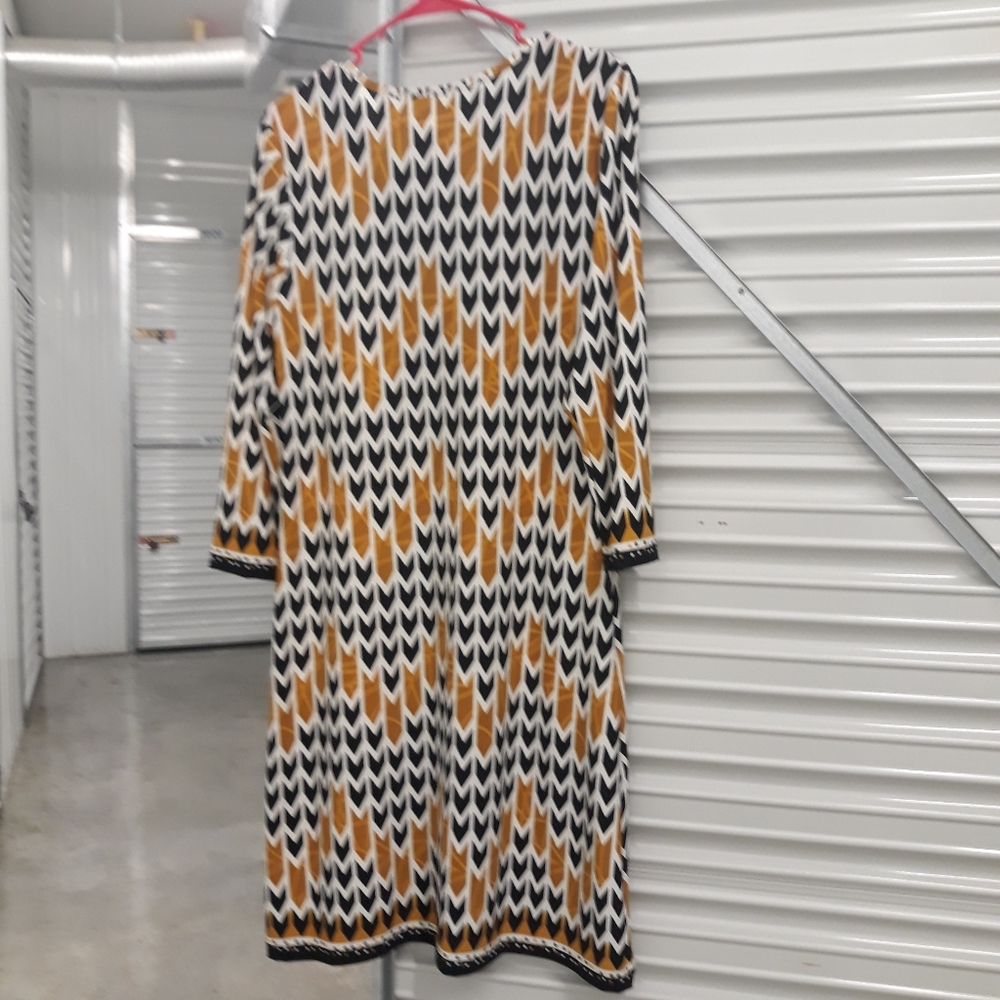 Gold/Black Dress Large with sleeves to elbow with a gold chain on front